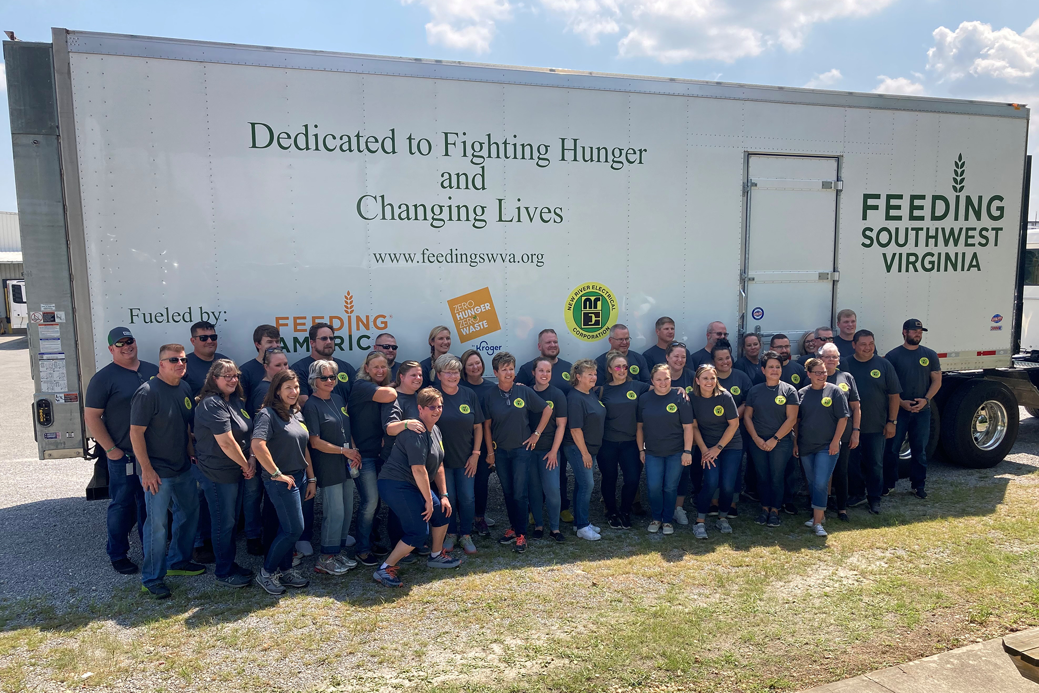 New River Employees standing in front of a Feeding Southwest Virginia trailer.