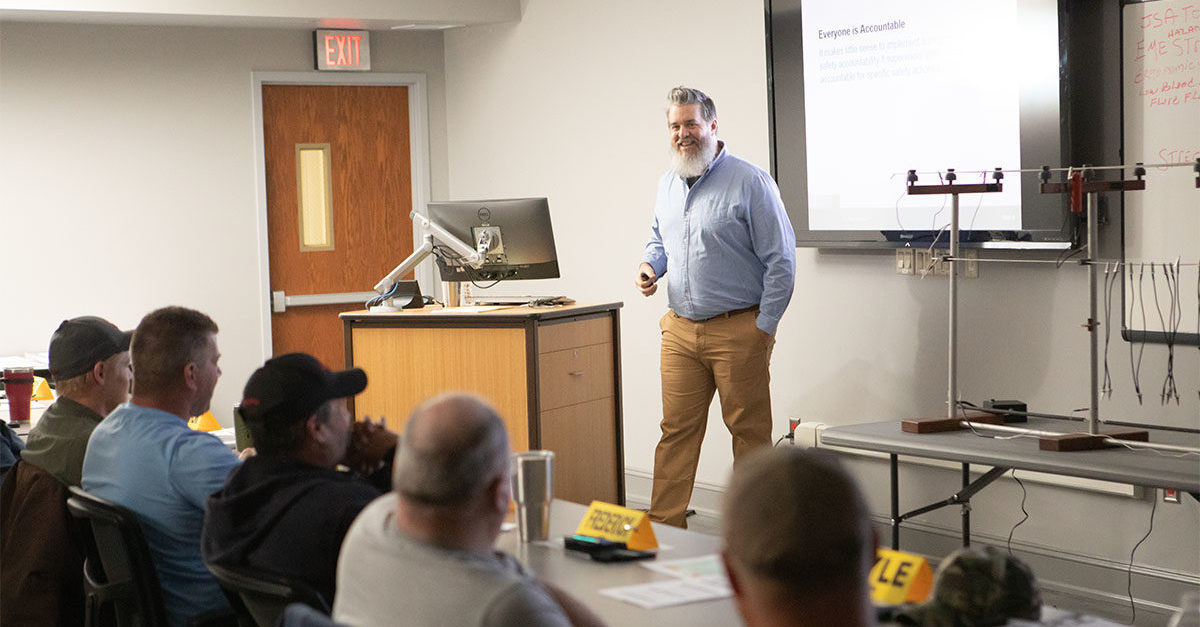 A New River Electrical Safety Staff member leading a safety class to student employees.