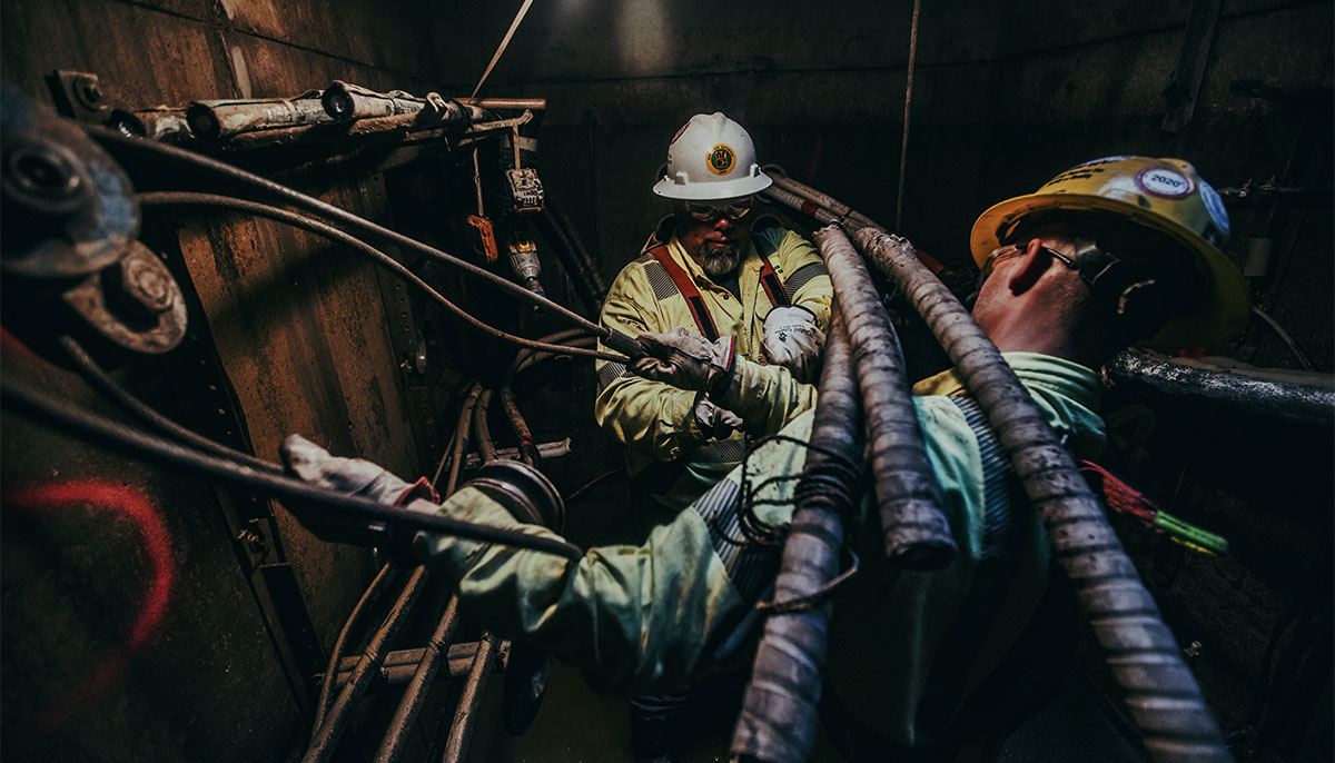 New River Electrical employees working underground with large electrical lines.