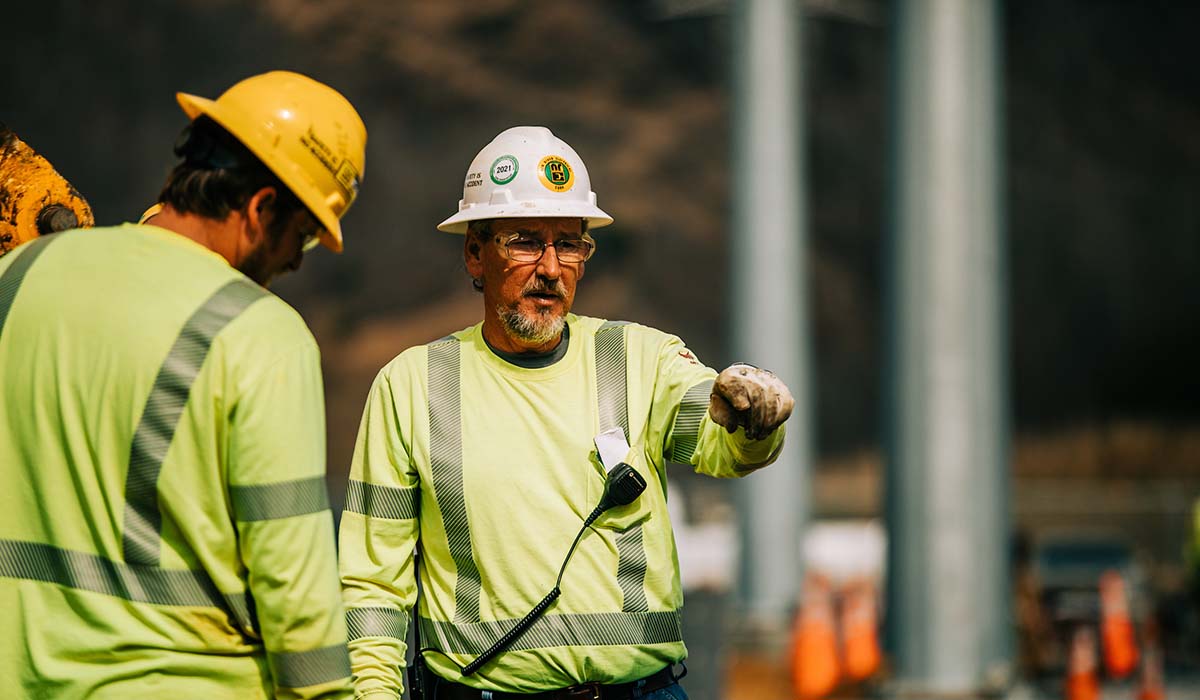 A New River General Contractor talking to an NRE employee on the job at Broadford, Va.