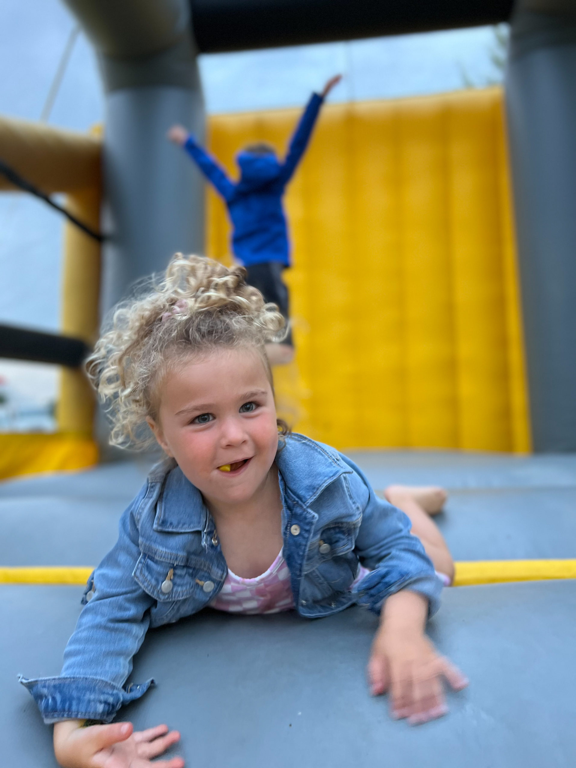 Small girl enjoying a bouncy house