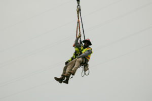 NRE Workers suspended high above ground