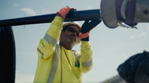 NRE employee assisting with line pull