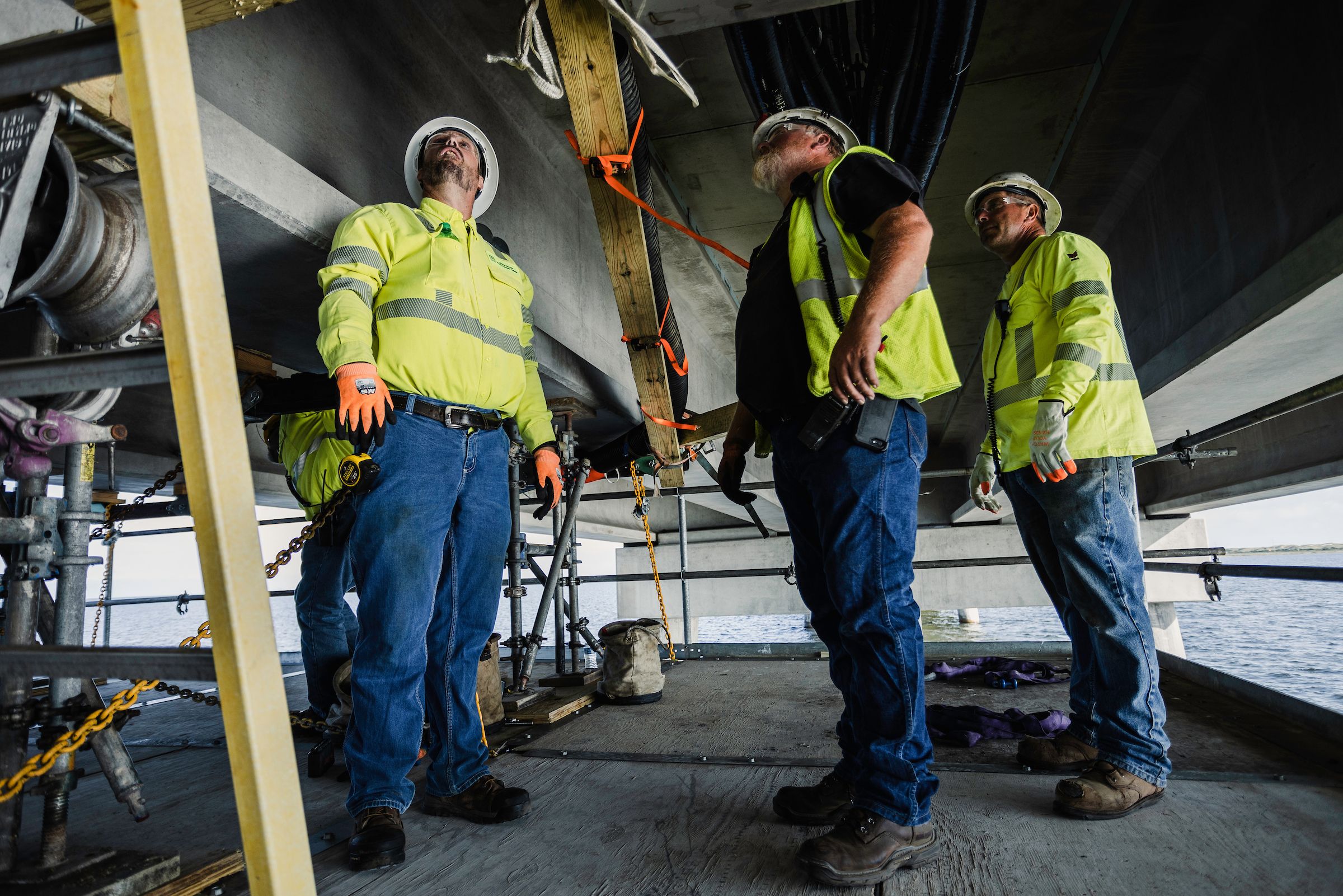 NRE employees working together underneath the Rodanthe Bridge in North Carolina.