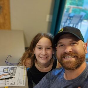 Father Daughter coloring together