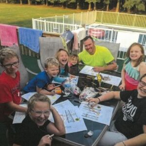 Family drawing together at a table